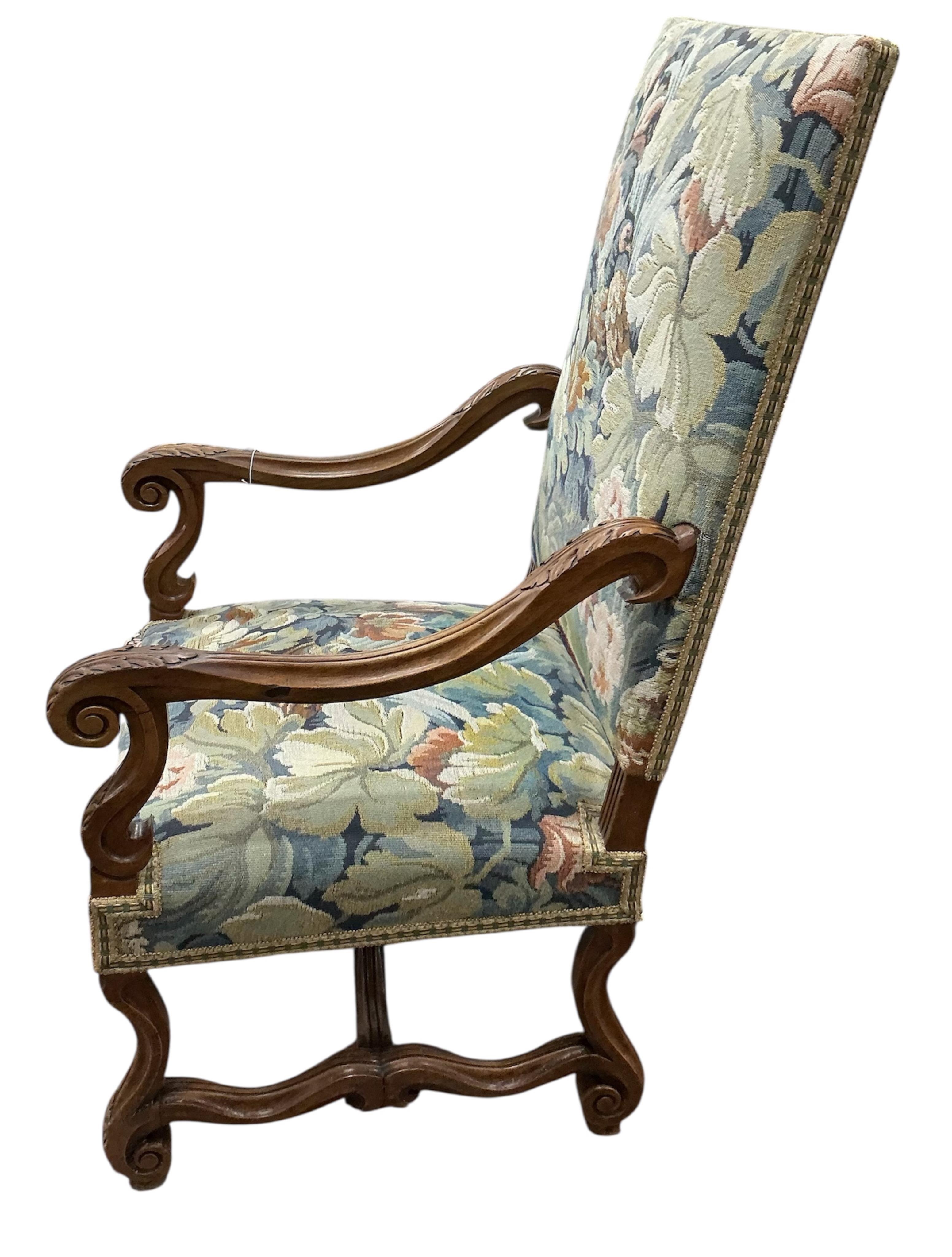 A pair of Louis XIII style walnut armchairs with tapestry upholstery, width 63cm, depth 63cm, height 115cm